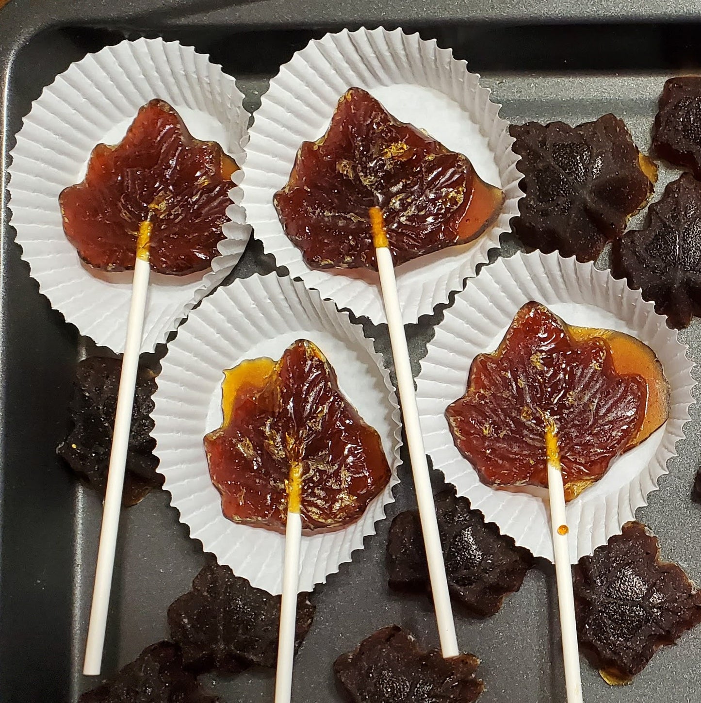 Our maple leaf form lollipop made from our hard maple sugar. Also shown is our maple suckers, also made with our hard maple sugar